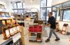 An employee removes American wines from an SAQ liquor store in Montreal on Tuesday, March 4, 2025. THE CANADIAN PRESS/Christinne Muschi