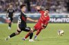 Liverpool's Darwin Nunez, right, and Marinos' Ren Kato battle for control of the ball during a friendly soccer match between Yokohama F. Marinos and Liverpool F.C. at Nissan Stadium in Yokohama, Japan, Wednesday, July 30, 2025. (AP Photo/Eugene Hoshiko)
