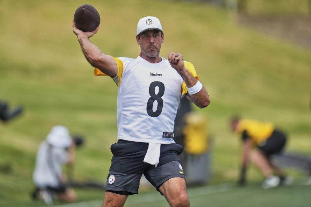 FILE - Pittsburgh Steelers quarterback Aaron Rodgers runs a drill during the NFL football team's training camp in Latrobe, Pa., Thursday, July 24, 2025. (AP Photo/Gene J. Puskar, File)
