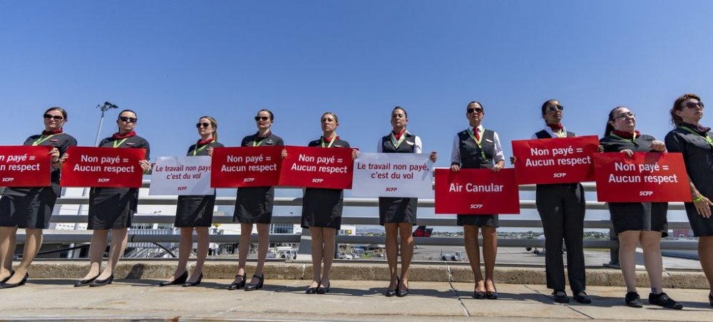 Air Canada flight attendants hold a silent protest at Montreal-Pierre Elliott Trudeau International Airport in Montreal, on Monday, Aug. 11, 2025. THE CANADIAN PRESS/Christinne Muschi