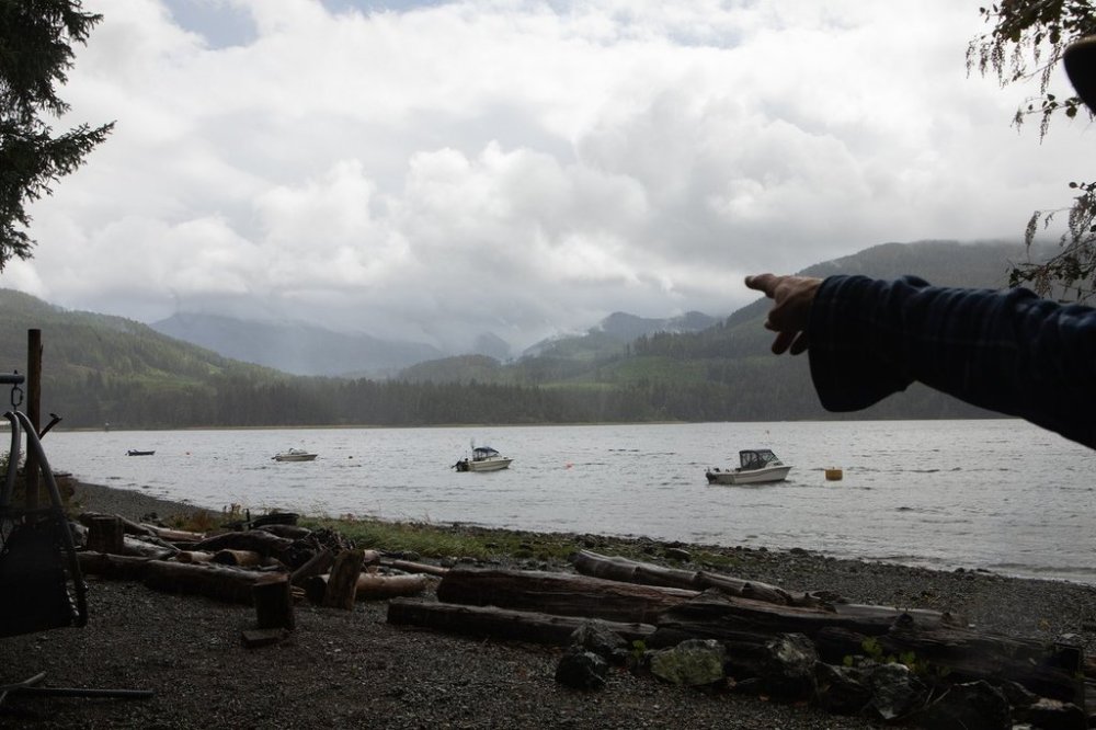 Rain and smoke from the Mount Underwood wildfire can be seen from across the Alberni Inlet at the Macktush Creek Campsite, south of Port Alberni, B.C., on Saturday, Aug. 16, 2025. THE CANADIAN PRESS/Chad Hipolito