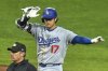 Los Angeles Dodgers' Shohei Ohtani (17) celebrates as he stands on second after driving in a run with a double off Pittsburgh Pirates pitcher Dennis Santana during the ninth inning of a baseball game in Pittsburgh, Tuesday, Sept. 2, 2025. (AP Photo/Gene J. Puskar)