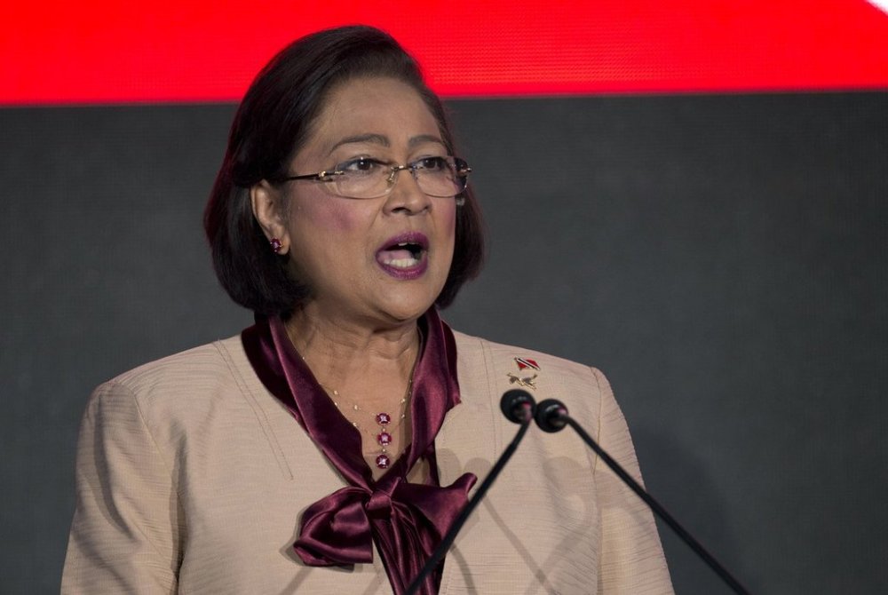 FILE - Trinidad and Tobago's Prime Minister Kamla Persad-Bissessar delivers her speech during the CEO Summit of the Americas in Panama City, April 10, 2015. (AP Photo/Moises Castillo, File)