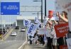 Air Canada flight attendants strike outside Montreal—Trudeau International Airport in Montreal, Saturday, Aug. 16, 2025. THE CANADIAN PRESS/Graham Hughes