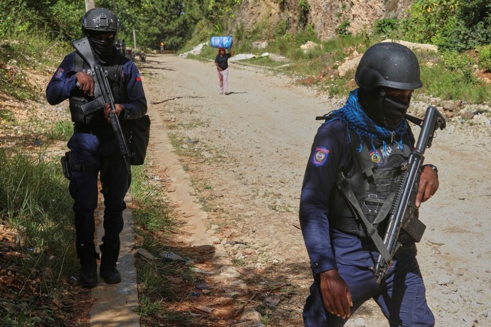 Police officers patrol the area near the Saint-Helene orphanage in the Kenscoff neighborhood of Port-au-Prince, Haiti, Monday, Aug. 4, 2025. (AP Photo/Odelyn Joseph)
