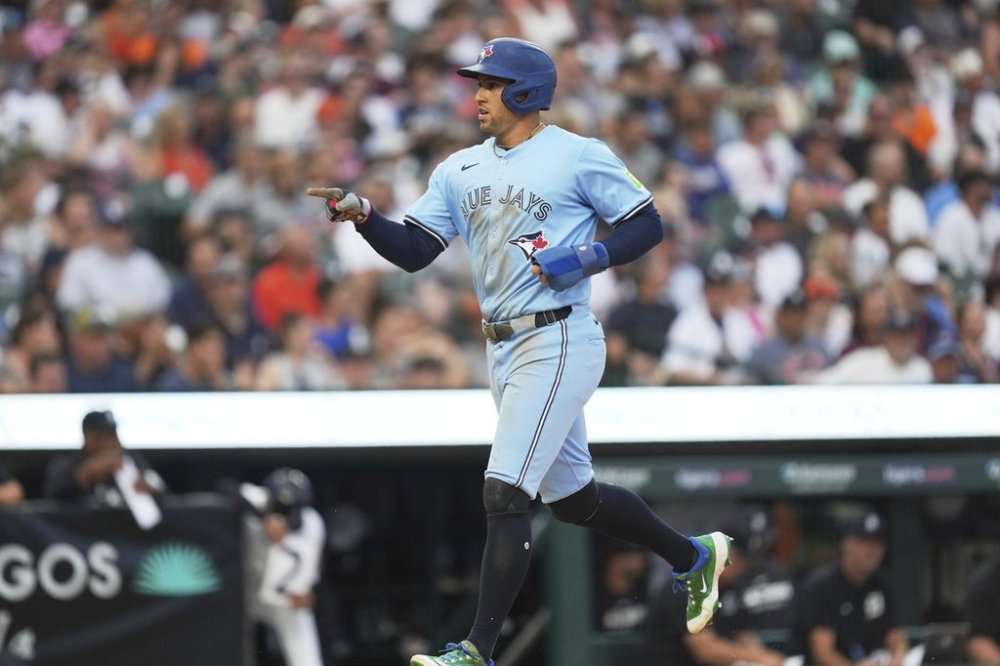 Toronto Blue Jays slugger George Springer scores against the Tigers during the sixth inning of a Major League Baseball game on Thursday, July 24, 2025, in Detroit. (AP Photo/Paul Sancya)