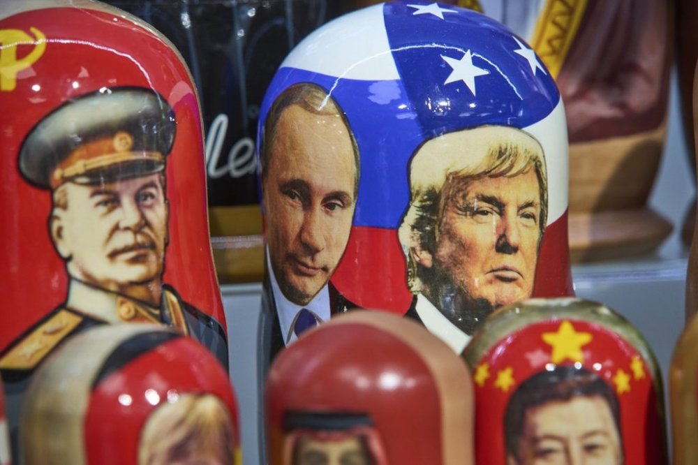 Traditional Russian wooden dolls called Matryoshka depicting Soviet Leader Josef Stalin, left, Russian President Vladimir Putin, center, and U.S. President Donald Trump are displayed for sale at a souvenir shop in Moscow, Russia, Tuesday, Aug. 12, 2025. (AP Photo/Alexander Zemlianichenko)