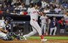 Boston Red Sox's Nathaniel Lowe follows through on an RBI single scoring Alex Bregman during the sixth inning of a baseball game against the New York Yankees, Sunday, Aug. 24, 2025, in New York. (AP Photo/Noah K. Murray)