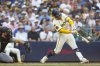 Milwaukee Brewers' William Contreras hits a two-run single against the Pittsburgh Pirates during the sixth inning of a baseball game, Wednesday, Aug. 13, 2025, in Milwaukee. (AP Photo/Jeffrey Phelps)