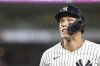 New York Yankees' Aaron Judge runs to the dugout after popping out to Boston Red Sox second baseman Romy Gonzalez during the seventh inning of a baseball game Friday, Aug. 22, 2025, in New York. (AP Photo/Pamela Smith)