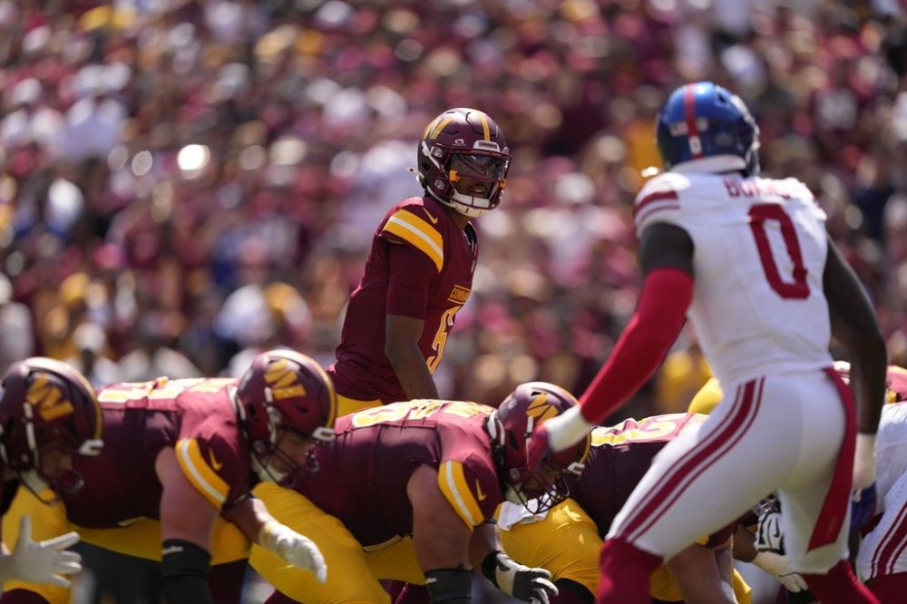 FILE - Washington Commanders' Jayden Daniels plays during an NFL football game against the New York Giants, Sept. 15, 2024, in Landover, Md. (AP Photo/Matt Slocum, File)