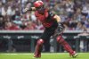Cincinnati Reds' Tyler Stephenson throws to first base in the fifth inning of a baseball game against the Milwaukee Brewers, Friday, Aug. 15, 2025, in Cincinnati. (AP Photo/Kareem Elgazzar)