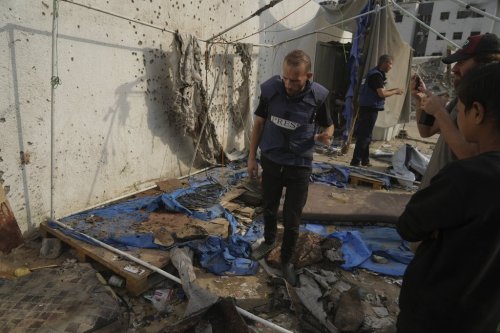 Palestinians inspect the destroyed tent where journalists, including Al Jazeera correspondents Anas al-Sharif and Mohamed Qureiqa, were killed by an Israeli airstrike outside the Gaza City's Shifa hospital complex Monday, Aug. 11, 2025. (AP Photo/Jehad Alshrafi)