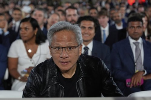 Nvidia CEO Jensen Huang arrives before President Donald Trump speaks during an AI summit at the Andrew W. Mellon Auditorium, Wednesday, July 23, 2025, in Washington. (AP Photo/Julia Demaree Nikhinson)