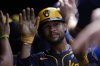Milwaukee Brewers' Blake Perkins celebrates after scoring on a single hit by Joey Ortiz during the eighth inning of a baseball game against the Chicago Cubs, Monday, Aug. 18, 2025, in Chicago. (AP Photo/Erin Hooley)
