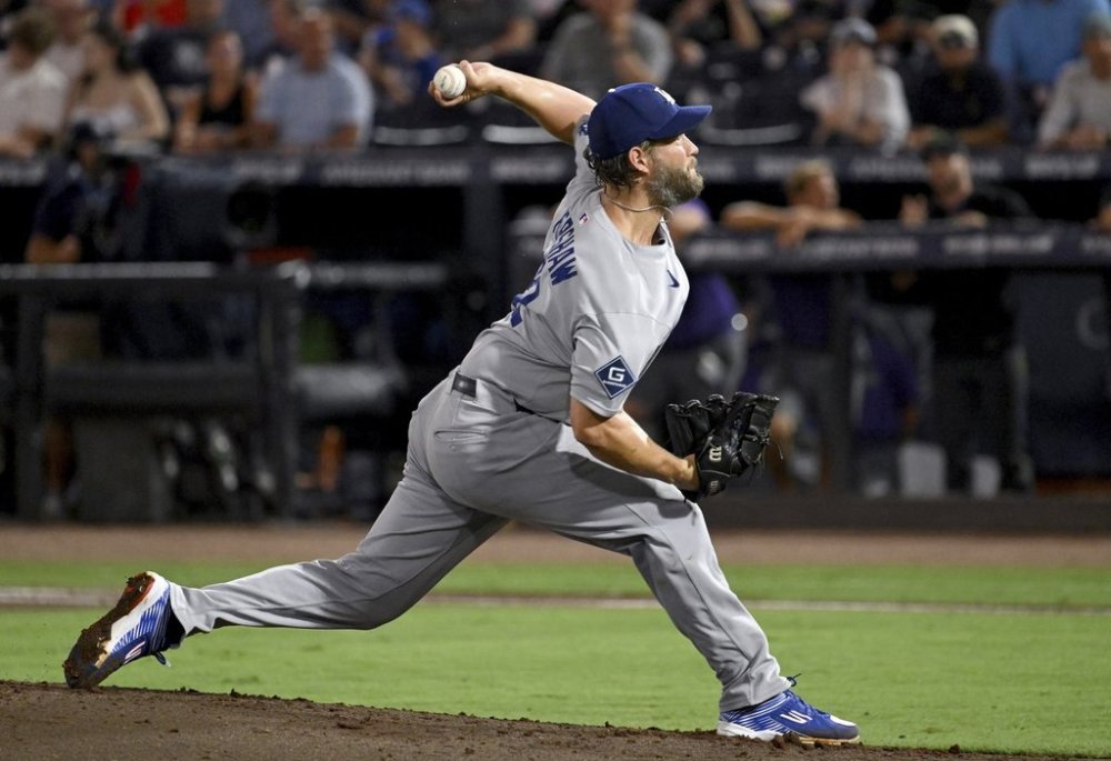 Los Angeles Dodgers pitcher Clayton Kershaw throws during the second inning of a baseball game against the Tampa Bay Rays Friday, Aug. 1, 2025, in Tampa, Fla. (AP Photo/Jason Behnken)