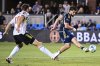 Vancouver Whitecaps forward Brian White, right, scores a goal over San Jose Earthquakes defender Dave Romney during the second half of an MLS soccer match Saturday, Aug. 9, 2025, in San Jose, Calif. (AP Photo/Thien-An Truong)