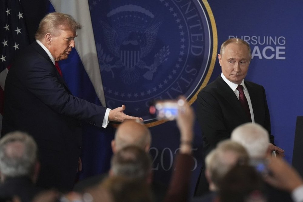 President Donald Trump, left, and Russia's President Vladimir Putin arrive for a joint press conference at Joint Base Elmendorf-Richardson, Alaska, Friday, Aug. 15, 2025. (AP Photo/Jae C. Hong)