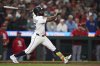 Seattle Mariners' Randy Arozarena follows through on an RBI sacrifice fly to score designated hitter Mitch Garver against the St. Louis Cardinals during the fourth inning of a baseball game Tuesday, Sept. 9, 2025, in Seattle. (AP Photo/Lindsey Wasson)