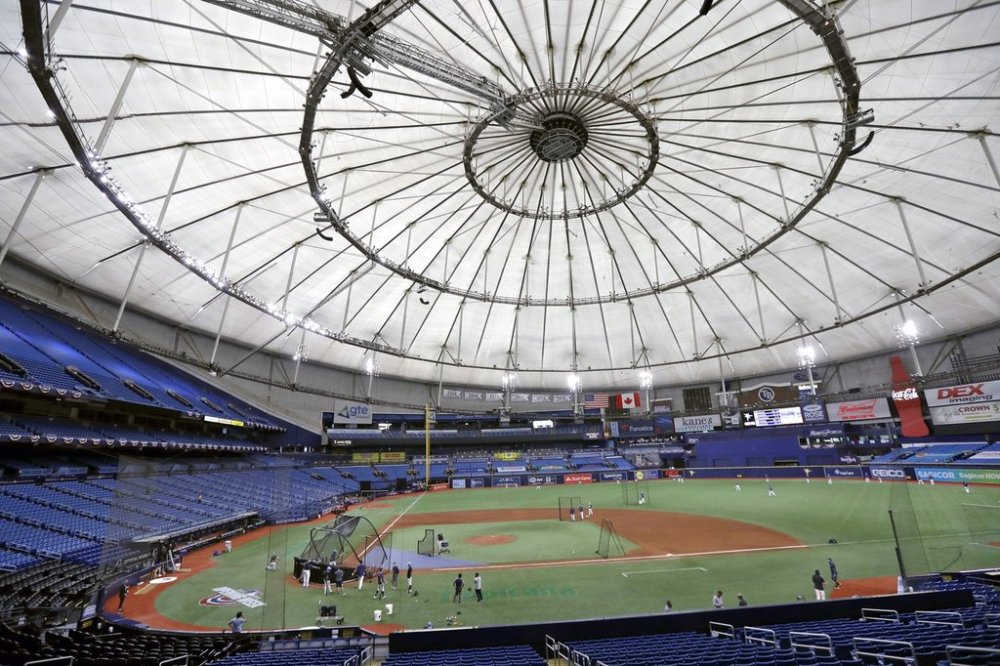 FILE — Members of the Tampa Bay Rays take batting practice at Tropicana Field before a baseball game against the Toronto Blue Jays, July 24, 2020, in St. Petersburg, Fla. (AP Photo/Chris O'Meara, File)