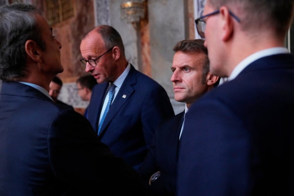 Germany's Chancellor Friedrich Merz and France's President Emmanuel Macron prior to an informal summit in the Danish parliament at Christiansborg Castle in Copenhagen, on Wednesday, Oct. 1, 2025. (Ida Marie Odgaard/Ritzau Scanpix via AP)