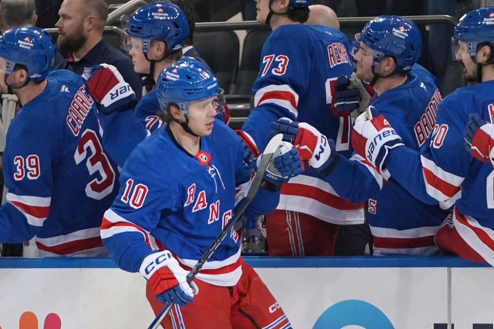 FILE - New York Rangers' Artemi Panarin (10) celebrates with teammates after scoring a goal during the first period of an NHL hockey game against the Calgary Flames, March 18, 2025, in New York. (AP Photo/Frank Franklin II, File)