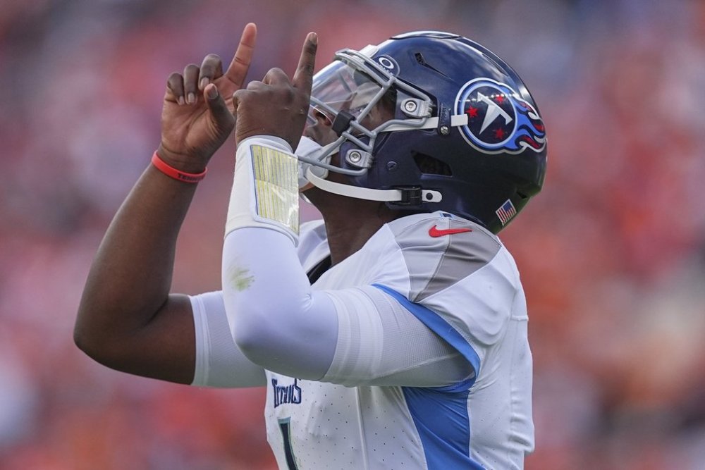 Tennessee Titans quarterback Cam Ward points to the sky during the first half of an NFL football game against the Denver Broncos, Sunday, Sept. 7, 2025, in Denver. (AP Photo/David Zalubowski)