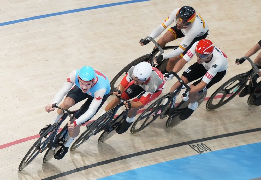 Canada's Dylan Bibic, left, competes in the Men's Omnium temp race during the 2024 Paris Summer Olympics in Saint-Quentin-en-Yvelines, France on Thursday, August 8, 2024. THE CANADIAN PRESS/Nathan Denette