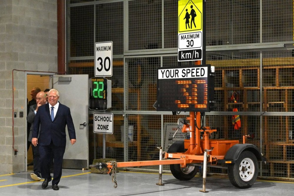 Premier Doug Ford arrives to speak about roadway speed cameras in Vaughan, Ontario on Thursday, Sept. 25, 2025. THE CANADIAN PRESS/Jon Blacker