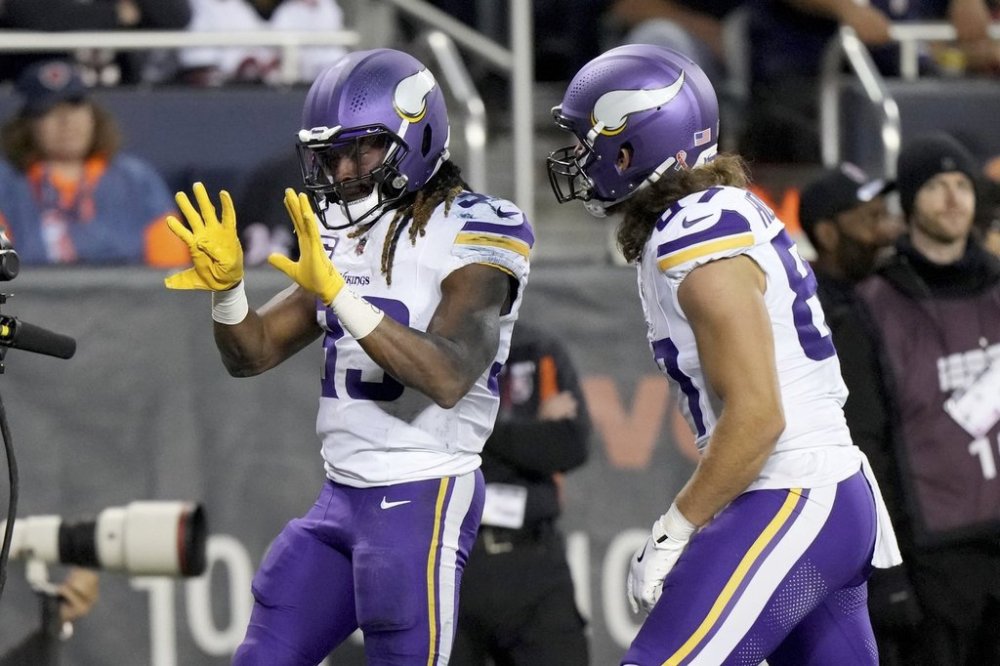Minnesota Vikings running back Aaron Jones Sr., left, celebrates after scoring as teammate T.J. Hockenson (87) watches during the second half of an NFL football game against the Chicago Bears Monday, Sept. 8, 2025, in Chicago. (AP Photo/Nam Y. Huh)