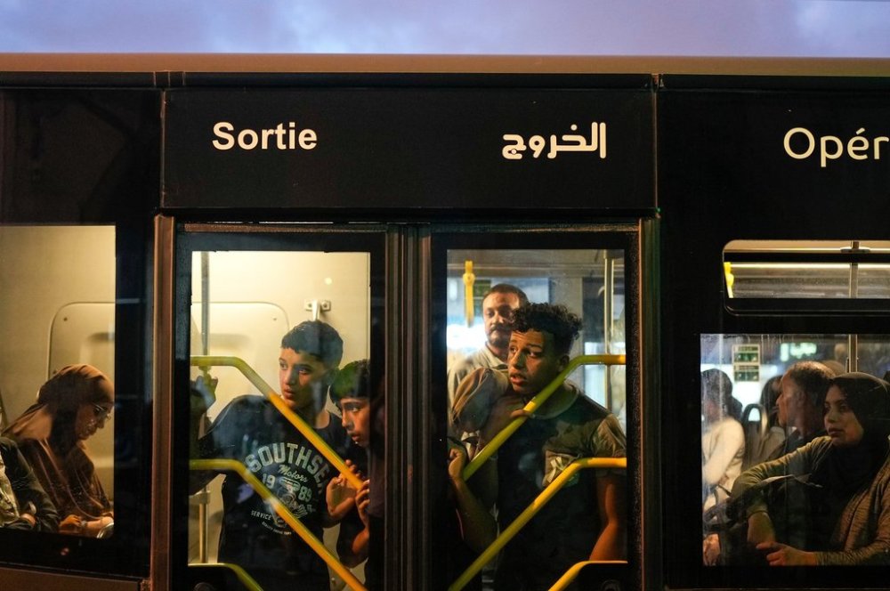 People observe as security forces detain a man taking part in a youth led protest calling for education and health reforms, in Casablanca, Morocco, Monday, Sept. 29, 2025. (AP Photo/Mosa'ab Elshamy)