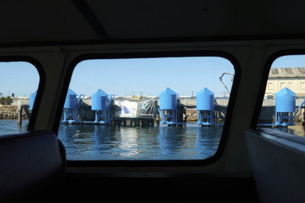 A boat goes past an onshore wave energy site, a pilot by Eco Wave Power, at the Port of Los Angeles' AltaSea ocean institute on Thursday, Sept. 4, 2025, in Los Angeles. (AP Photo/Damian Dovarganes)