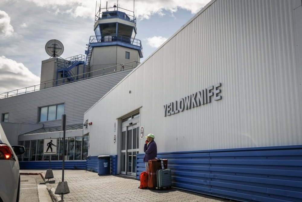 A passenger waits for a ride at Yellowknife Airport on Tuesday, July 22, 2025. THE CANADIAN PRESS/Jeff McIntosh