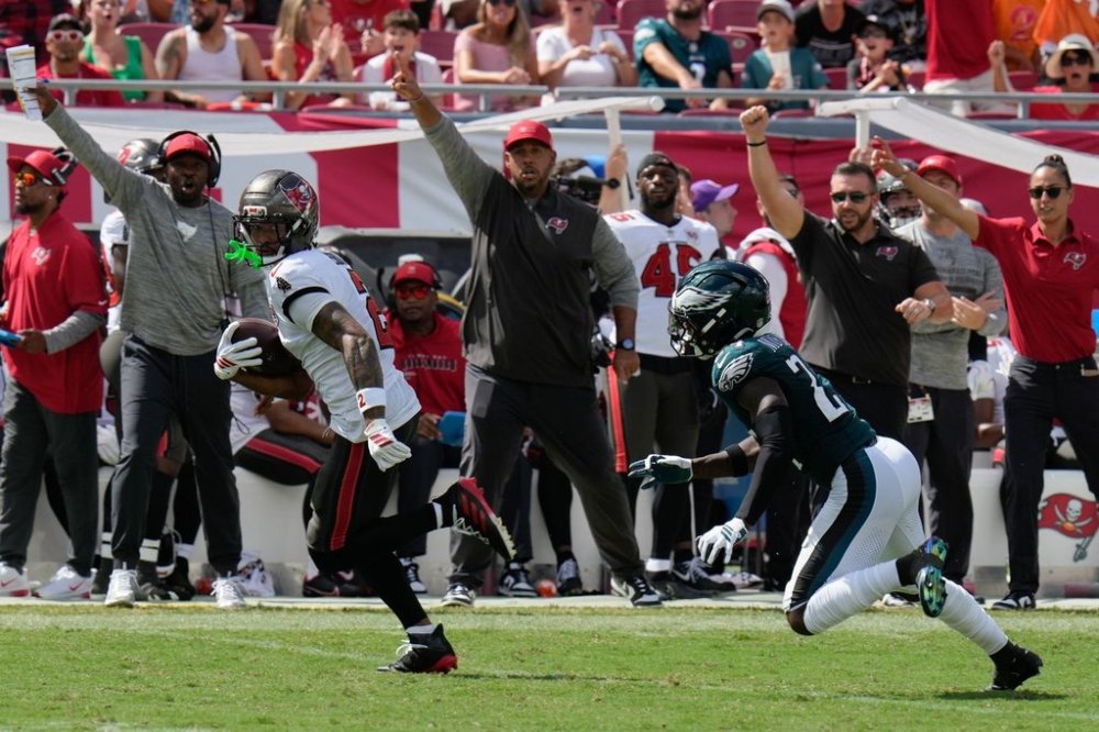 Tampa Bay Buccaneers wide receiver Emeka Egbuka (2) runs for a touchdown during the second half of an NFL football game against the Philadelphia Eagles, Sunday, Sept. 28, 2025, in Tampa, Fla. (AP Photo/Chris O'Meara)