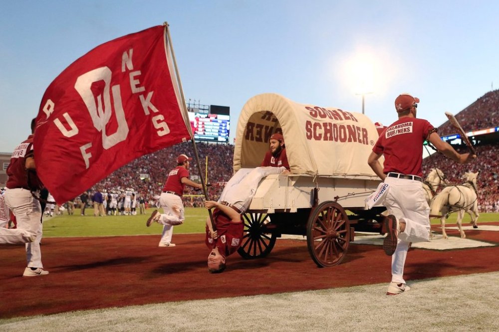 The Oklahoma Sooner Schooner and the Ruf Neks ride out onto the field following an Oklahoma touchdown over TCU during the first half of an NCAA college football game on Saturday, Oct. 5, 2013, in Norman, Okla. Oklahoma won 20-17. (AP Photo/Alonzo Adams, File)