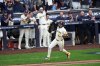 Milwaukee Brewers' Jackson Chourio hits a two-run scoring single during the first inning of Game 1 of baseball's National League Division Series against the Chicago Cubs Saturday, Oct. 4, 2025, in Milwaukee. (AP Photo/Morry Gash)