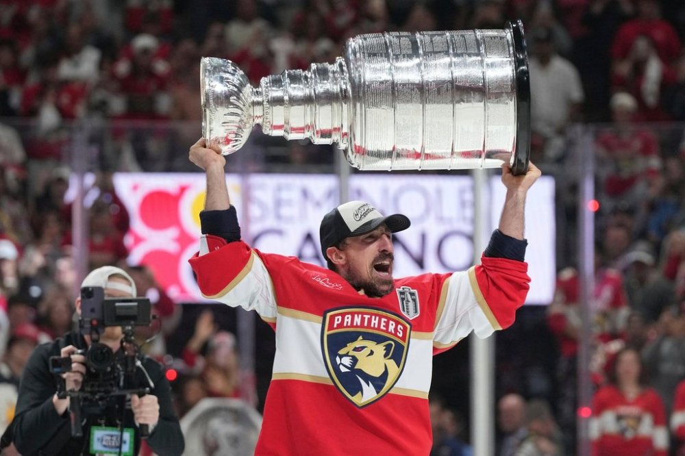 FILE - Florida Panthers center Brad Marchand skates with the Stanley Cup after defeating the Edmonton Oilers in Game 6 of the NHL hockey Stanley Cup Final Tuesday, June 17, 2025, in Sunrise, Fla. (AP Photo/Lynne Sladky, File)