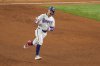 Texas Rangers' Michael Helman reacts after hitting a grand slam home run off Milwaukee Brewers starting pitcher Jose Quintana during the fifth inning of a baseball game Monday, Sept. 8, 2025, in Arlington, Texas. (AP Photo/Julio Cortez)