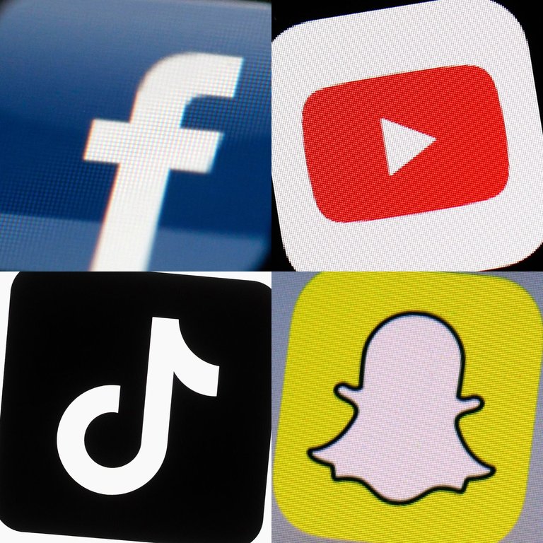 FILE - This combination of photos from 2017 to 2022 shows the logos of Facebook, YouTube, TikTok and Snapchat on mobile devices. (AP Photo, File)