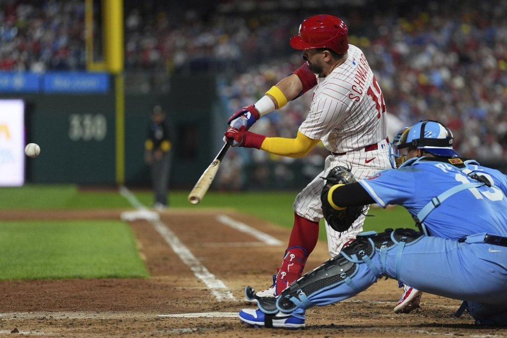 Philadelphia Phillies' Kyle Schwarber hits a home run off of Kansas City Royals pitcher Angel Zerpa during the fifth inning of a baseball game, Saturday, Sept. 13, 2025, in Philadelphia. (AP Photo/Matt Rourke)
