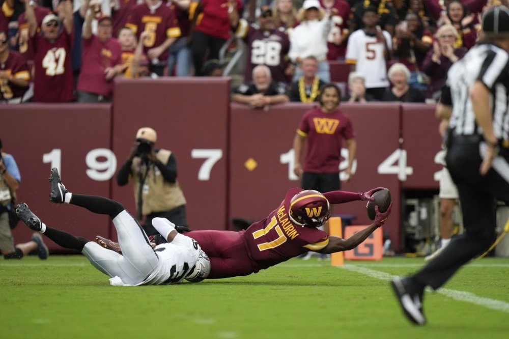 Washington Commanders wide receiver Terry McLaurin (17) is brought down by Las Vegas Raiders cornerback Kyu Blu Kelly (36) during the second half of NFL football game Sunday, Sept. 21, 2025, in Landover, Md. (AP Photo/Stephanie Scarbrough)