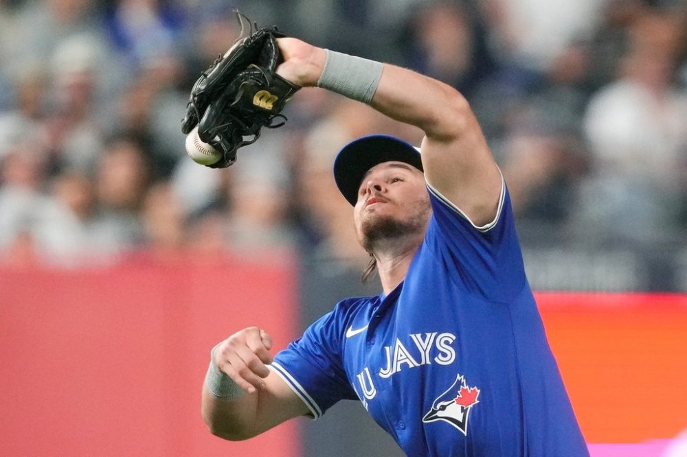 Toronto Blue Jays third baseman Addison Barger drops a fly ball hit by New York Yankees' Austin Wells during the fourth inning of Game 3 of baseball's American League Division Series, Tuesday, Oct. 7, 2025, in New York.(AP Photo/Yuki Iwamura)