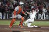 Arizona Diamondbacks' Corbin Carroll scores a run after a walk off single by Jordan Lawlar in the ninth inning of a baseball game against the San Francisco Giants, Tuesday, Sept. 16, 2025, in Phoenix. (AP Photo/Rick Scuteri)