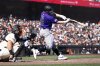 Colorado Rockies' Blaine Crim cracks his bat on a line out during the eighth inning of an MLB baseball game against the San Francisco Giants, Saturday, Sept. 27, 2025, in San Francisco. (AP Photo/Benjamin Fanjoy)