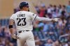 Minnesota Twins' Royce Lewis points to the bench after hitting a three-run home run against the Cleveland Guardians in the seventh inning of a baseball game Sunday, Sept. 21, 2025, in Minneapolis. (AP Photo/Bruce Kluckhohn)