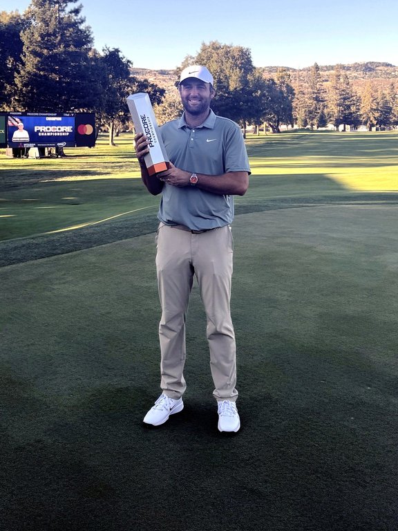 Scottie Scheffler holds the trophy after winning the Procore Championship on Sunday, Sept. 14, 2025, at Silverado Resort in Napa, California, for his sixth PGA Tour title of the year. (AP Photo/Doug Ferguson)