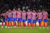 FILE - Atletico Madrid players stand together during a penalty shootout at the end of the Champions League round of 16, second leg, soccer match between Atletico Madrid and Real Madrid at the Metropolitano stadium in Madrid, Spain, March 12, 2025. (AP Photo/Manu Fernandez, file)