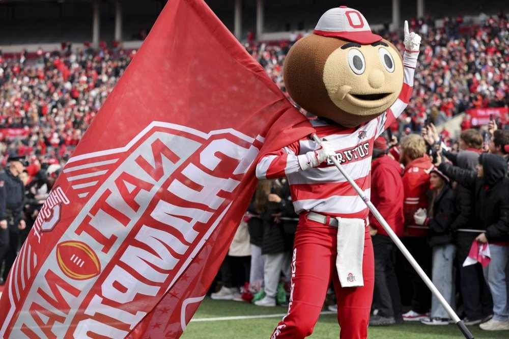 FILE - Brutus Buckeye leads football fans during the National Championship celebration at Ohio Stadium in Columbus, Ohio, Sunday, Jan. 26, 2025. (AP Photo/Joe Maiorana,File)