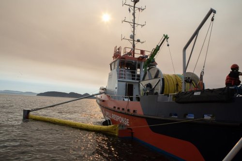 Crew prepare to deploy an offshore containment boom while aboard the skimming vessel the Hecate Sentinel during a Western Canada Marine Response Corporation joint training exercise off the coast Moresby Island, B.C., on Wednesday, Sept. 17, 2025. THE CANADIAN PRESS/Chad Hipolito