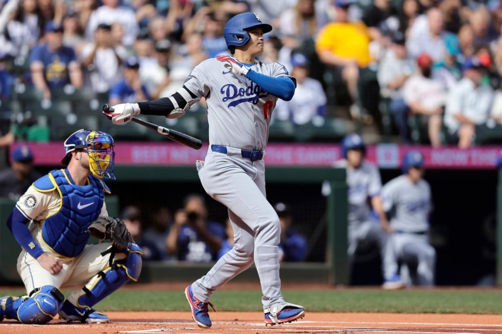 Los Angeles Dodgers Shohei Ohtani doubles against the Seattle Mariners during a baseball game, Sunday, Sept. 28, 2025, in Seattle. (AP Photo/John Froschauer)